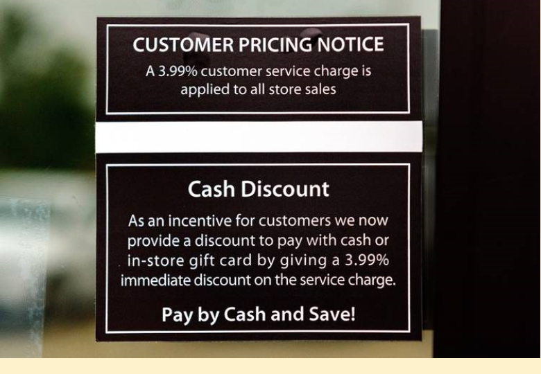 An example of cash discount program signage.